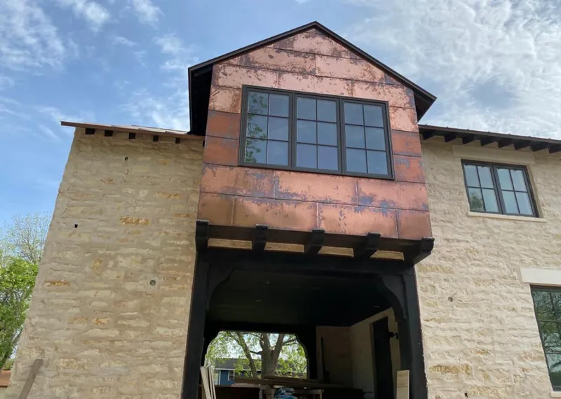 Copper metal panel facade on a stone building for Skylight Installation in Hillsboro