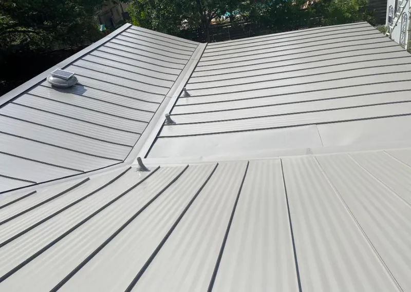 Solar attic fan installed on a metal roof for Roof Ventilation in Hillsboro